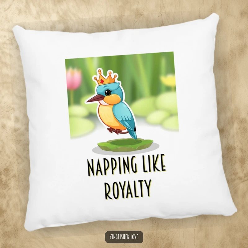 Funny pillow featuring a kingfisher with a tiny, comical crown, looking surprised while perched on a lily pad.
