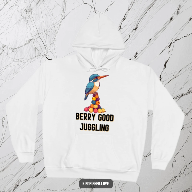 Funny Kingfisher Hoodie: A cute kingfisher struggles to balance a precarious stack of vibrant berries, creating a comical scene.