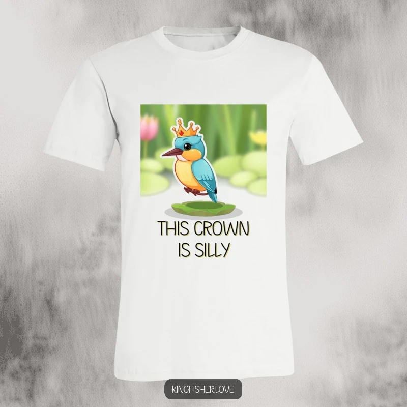 Funny T-shirt featuring a kingfisher with a tiny, silly crown, perched on a lily pad and looking comically surprised.